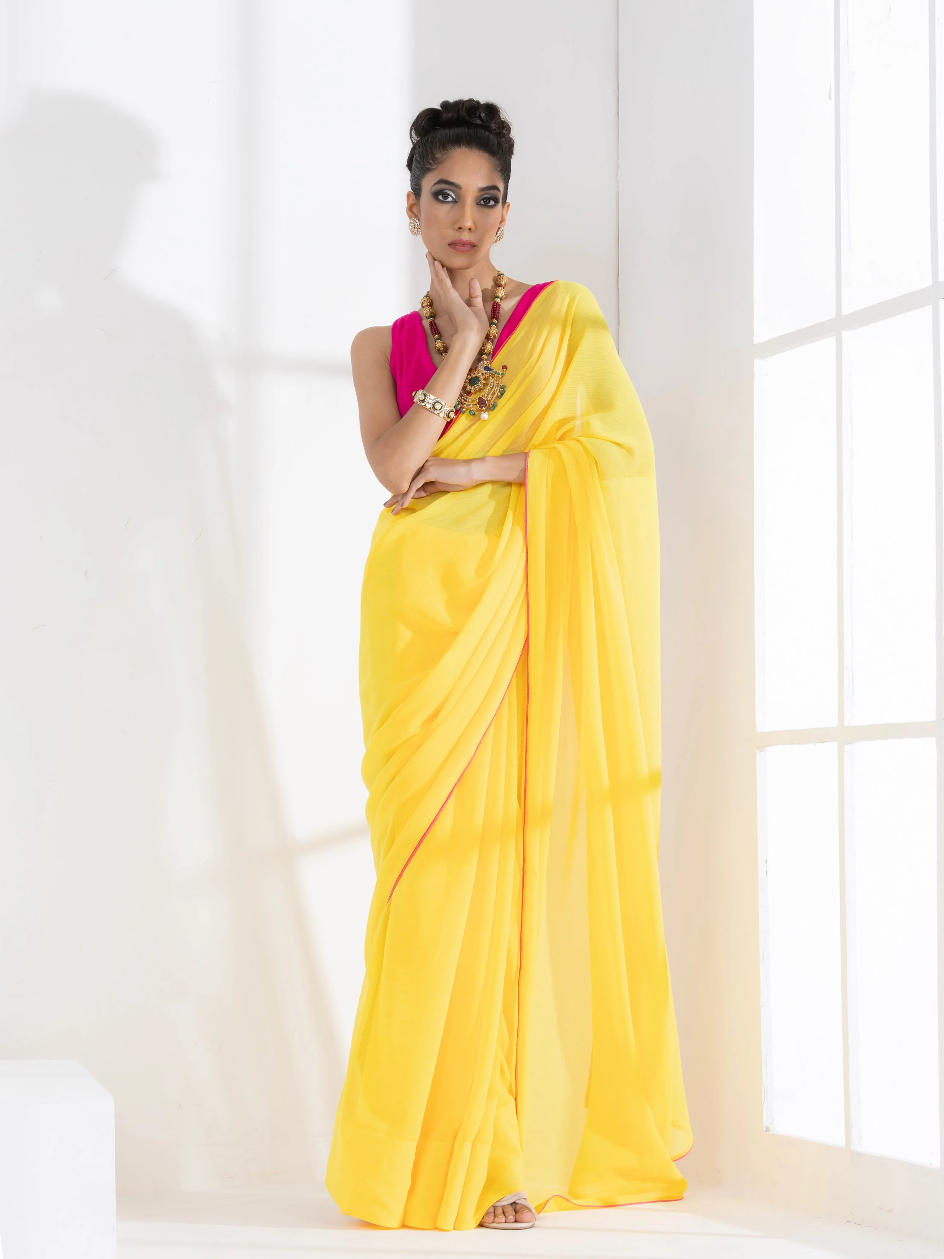 Corn Yellow Textured Chiffon Saree with Pink Piping and Fuchsia Blouse Fabric