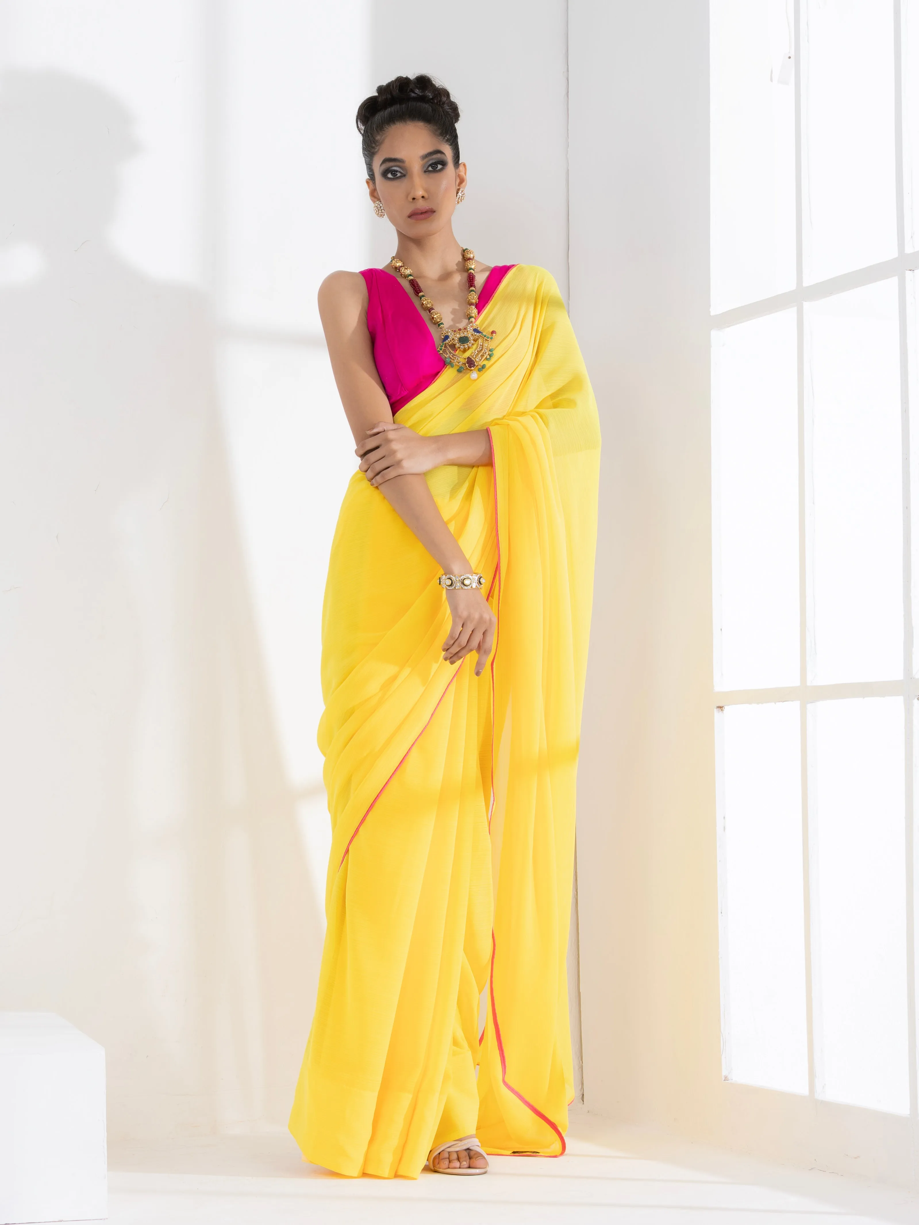Corn Yellow Textured Chiffon Saree with Pink Piping and Fuchsia Blouse Fabric