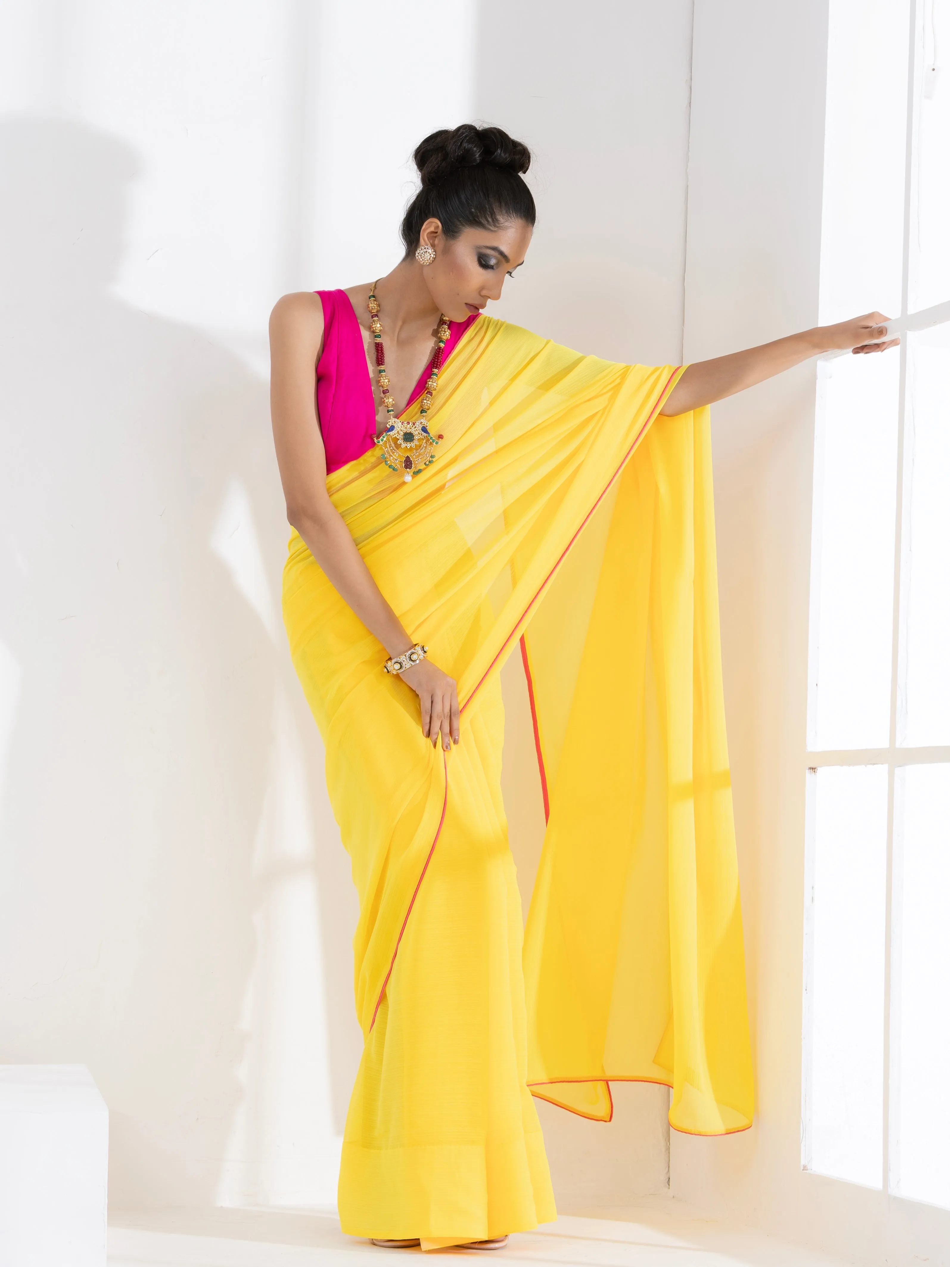 Corn Yellow Textured Chiffon Saree with Pink Piping and Fuchsia Blouse Fabric